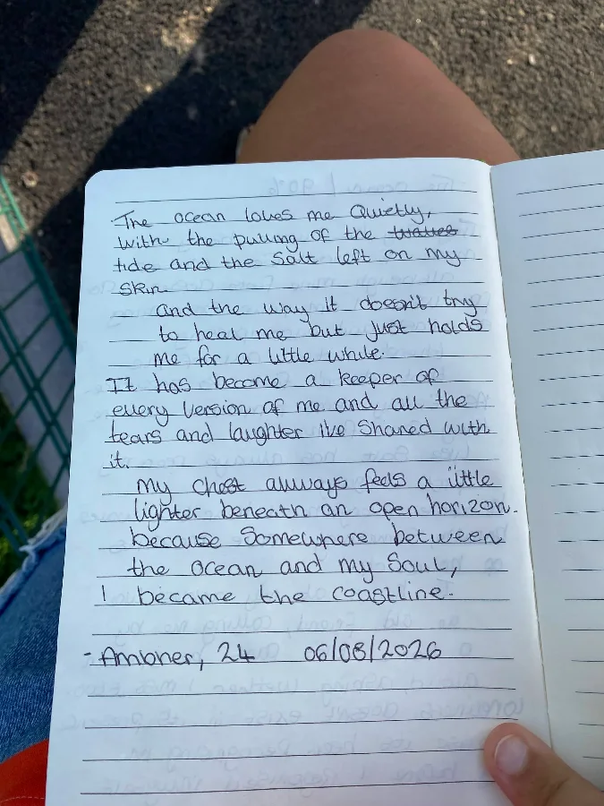 The second page of the handwritten poem, ending 'I became the coastline' and signed Ambher, 24, 06/08/2026.
